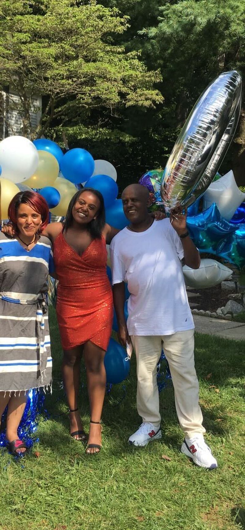 Hasset celebrating her 2020 high school graduation with her parents, her mom Chaltu Woldemariam and her dad, Temesgen Tsegaye.
CONTRIBUTED