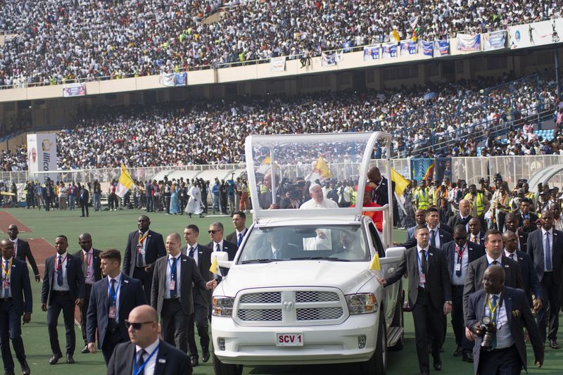 FILE - Pope Francis on the popemobile, waves at worshipers at the Martyrs' Stadium in Kinshasa, Congo, on Feb. 2, 2023. (AP Photo/Samy Ntumba Shambuyi, File)