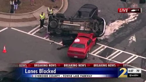 A car overturned on top of two vehicles in Cherokee County on Wednesday afternoon.