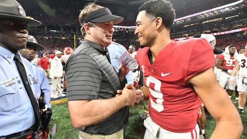 Georgia's head coach Kirby Smart talks to Alabama's quarterback Bryce Young (9) after Alabama beat Georgia during the Southeastern Conference championship game at Mercedes-Benz Stadium in Atlanta on Saturday, December 4, 2021. (Hyosub Shin / Hyosub.Shin@ajc.com)