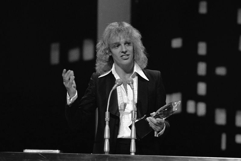 FILE - Musician Peter Frampton holds his award for best male artist at the Fourth Annual People's Choice Awards on Feb. 20, 1978. (AP Photo)