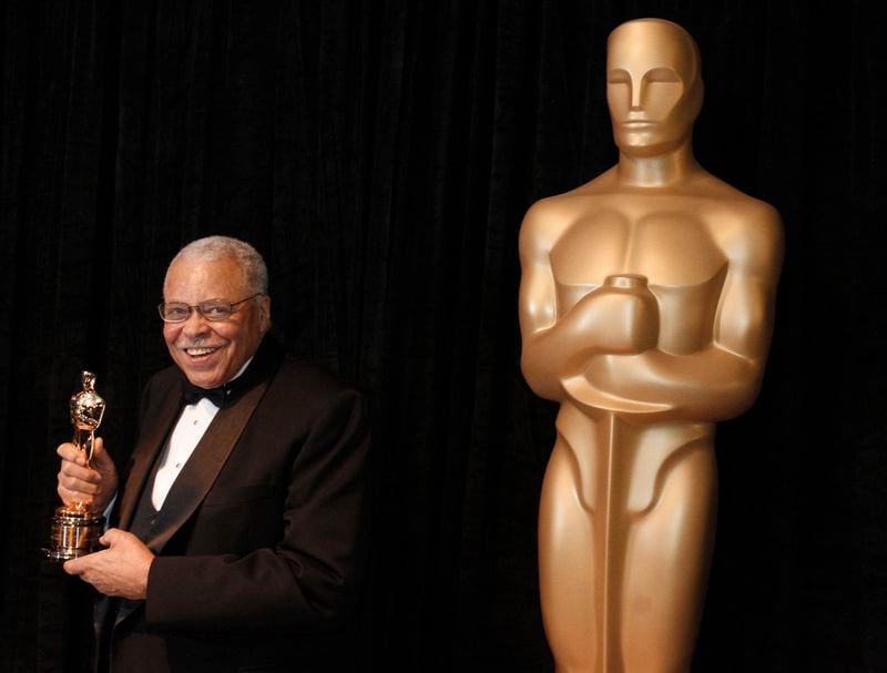 FILE - James Earl Jones poses with his honorary Oscar at the 84th Academy Awards on Sunday, Feb. 26, 2012, in the Hollywood section of Los Angeles. Jones, who overcame racial prejudice and a severe stutter to become a celebrated icon of stage and screen has died at age 93, Monday, Sept. 9, 2024. (AP Photo/Chris Carlson, File)