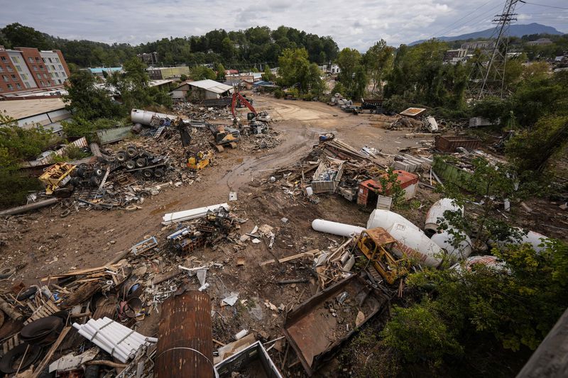 Debris is seen in the aftermath of Hurricane Helene, Monday, Sept. 30, 2024, in Ashville, N.C. (AP Photo/Mike Stewart)