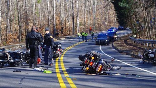 Three officers were injured after their motorcycles slid  on ice in Kennesaw.