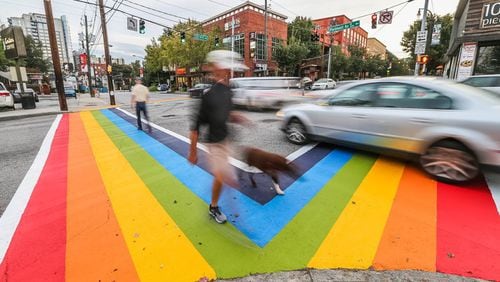Two weeks after the 2015 Atlanta Pride celebration, crews removed the four rainbow crosswalks at the intersection of 10th and Piedmont near Piedmont Park. Organizers said the city promised the symbol for LGBTQ rights would be a permanent fixture, but later rescinded. City officials cited Federal Highway Administration rules for why the display had to be erased. AJC file photo