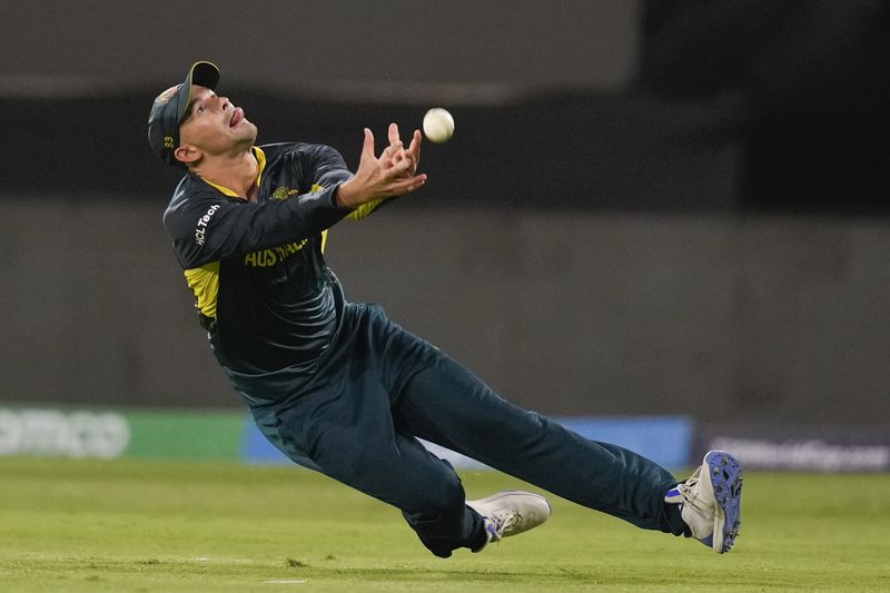 Australia's Ashton Agar drops a catch during the men's T20 World Cup cricket match between Afghanistan and Australia at Arnos Vale Ground, Kingstown, Saint Vincent and the Grenadines, Saturday, June 22, 2024. (AP Photo/Ramon Espinosa)