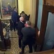 In this image from video, a security video shows Vice President Mike Pence being evacuated from near the Senate chamber as rioters breach the Capitol, on Jan. 6, 2021, at the Capitol in Washington. (Senate Television via AP)