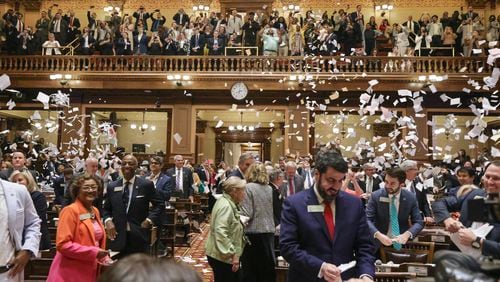 House members throw up paper at the conclusion of the legislative session in the House Chamber on Sine Die, the last day of the General Assembly at the Georgia State Capitol in Atlanta on Wednesday, March 29, 2023. (Natrice Miller/ natrice.miller@ajc.com)