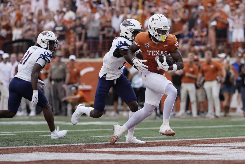 Texas wide receiver Johntay Cook II (1) scores a touchdown against UTSA during the first half of an NCAA college football game in Austin, Texas, Saturday, Sept. 14, 2024. (AP Photo/Eric Gay)