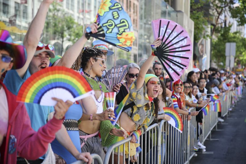 Revelers cheers along the route during a Pride Parade, Sunday, June 30, 2024, in San Francisco. (AP Photo/Ethan Swope)
