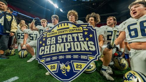 Thomas County Central celebrates after winning the Class 6A state title over Woodward Academy Tuesday.