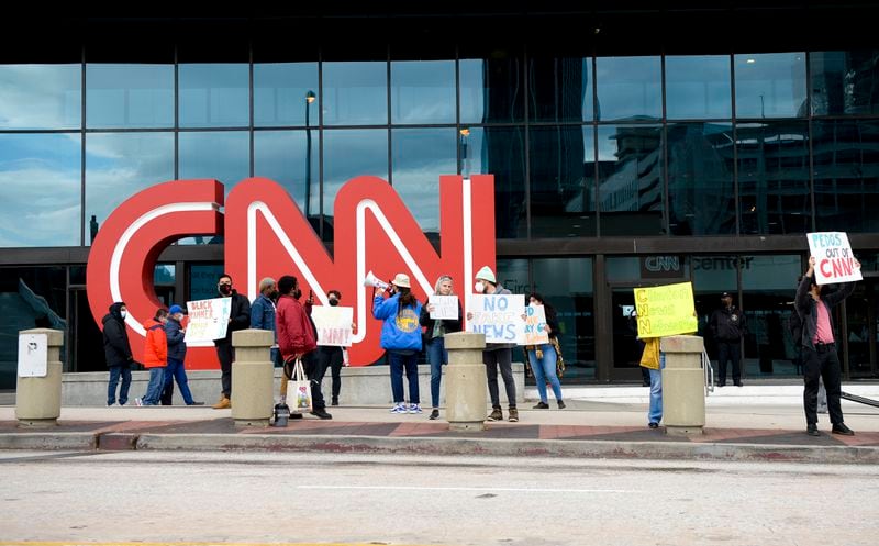 The group representing Black Hammer gathered to protest CNN’s “cover up of the election, misrepresentation of the January 6 freedom fighters, the vaccine effectiveness and overall lying to the American people”.  (Daniel Varnado/For the Atlanta Journal-Constitution)