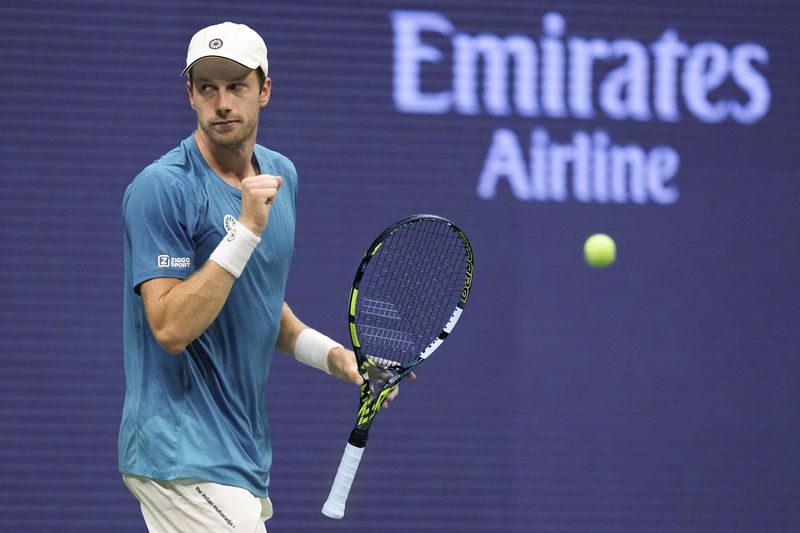 Botic van De Zandschulp, of the Netherlands, reacts after scoring a point against Carlos Alcaraz, of Spain, during the second round of the U.S. Open tennis championships, Thursday, Aug. 29, 2024, in New York. (AP Photo/Matt Rourke)