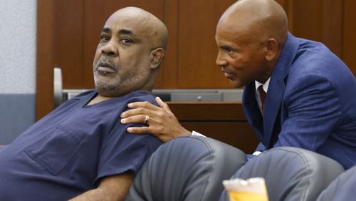 Duane "Keffe D" Davis, left, who is accused of orchestrating the 1996 slaying of hip-hop icon Tupac Shakur, listens to his attorney Carl Arnold during a hearing to reconsider his bond at the Regional Justice Center, on Tuesday, July. 23, 2024, in Las Vegas. (Bizuayehu Tesfaye/Las Vegas Review-Journal via AP)