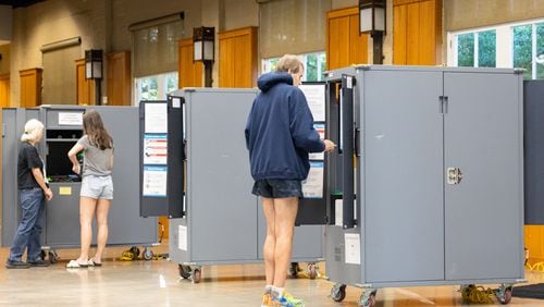 Fulton County residents vote on primary election day at Magnolia Hall in Piedmont Park in Atlanta on May 21. Some Georgia voters will return to the polls Tuesday to cast ballots in runoffs for races that were not settled in May. (Arvin Temkar / AJC)