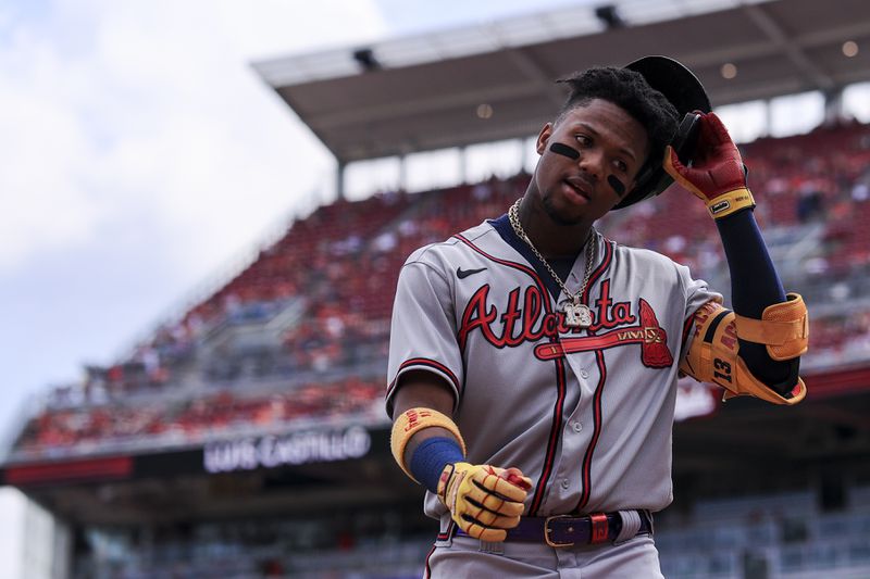 Atlanta Braves' Ronald Acuna Jr. walks to the dugout during a baseball game against the Cincinnati Reds in Cincinnati, Saturday, June 26, 2021. The Reds won 4-1. (AP Photo/Aaron Doster)