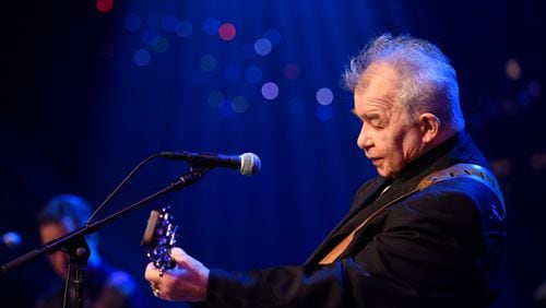 John Prine is still hospitalized with coronavirus.