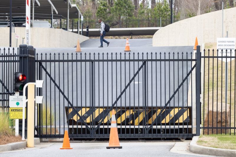 A view of the gate and barricade at the entrance to the FBI field office in Chamblee.