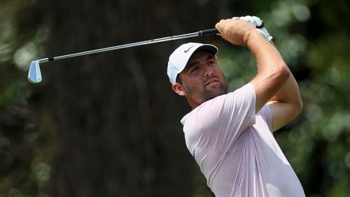 Scottie Scheffler tees off on the second hole during the second round of the Tour Championship at East Lake Golf Club, on Friday, Aug. 30, 2024, in Atlanta. (Jason Getz / AJC)
