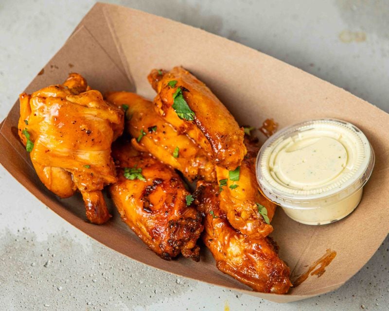 Dhaba BBQ's lemon pepper masala wings incorporate Indian seasonings like ginger, cumin and curries into traditional lemon pepper wet wings. / Courtesy of Dhaba BBQ
