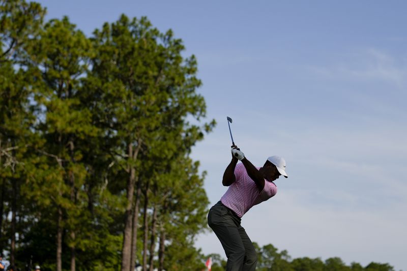 Tiger Woods hits his tee shot on the 15th hole during the first round of the U.S. Open golf tournament Thursday, June 13, 2024, in Pinehurst, N.C. (AP Photo/Matt York)