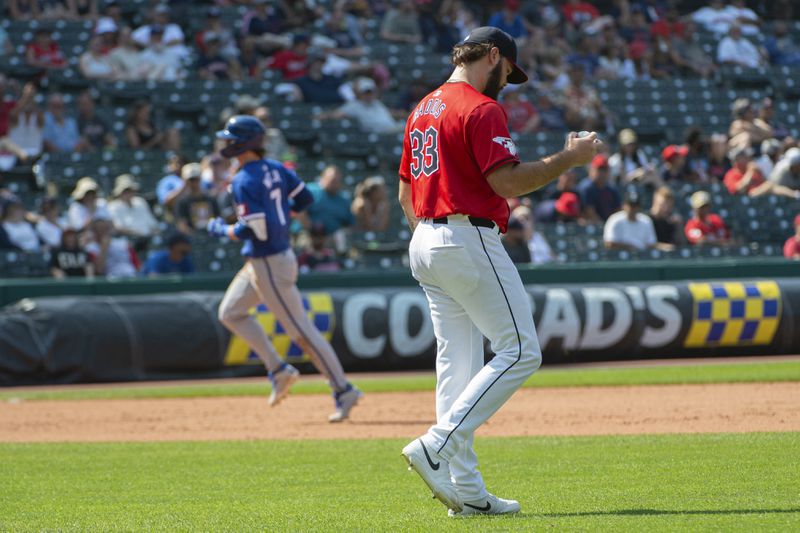 Cleveland Guardians starting pitcher Hunter Gaddis, front, reacts after giving up a solo home run to Kansas City Royals' Bobby Witt Jr., rear, during the eighth inning of the first game of a baseball doubleheader in Cleveland, Monday, Aug. 26, 2024. (AP Photo/Phil Long)