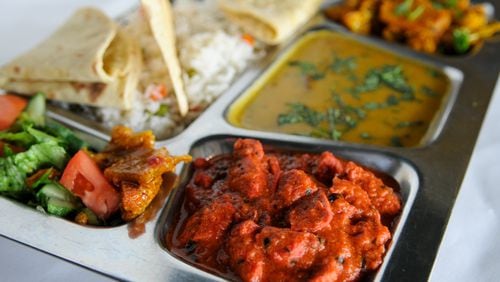 Thali combo platter of Chicken Tikka, Daal and califlower served with rice pullao, raita, papadam and chapati at Bhojanic. (BECKY STEIN/special)