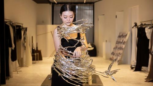 Singapore designer Grace Ling displays 3D printed designs from her New York Fashion Week collection on Friday, Sept. 13, 2024, in New York. Ling is one of ten designers competing in the 2024 CFDA/Vogue Fashion Fund. (Photo by Matt Licari/Invision/AP)