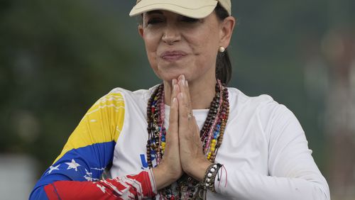 Opposition leader Maria Corina Machado greets supporters at a campaign rally for presidential candidate Edmundo Gonzalez, in Valencia, Venezuela, Saturday, July 13, 2024. (AP Photo/Ariana Cubillos)