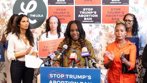 Shawana Moore, a women’s health nurse practitioner and professor at Emory University, speaks at a news conference marking two years since Roe v. Wade was overturned. Abortion is on the ballot in 2024, she said. “Human rights are at risk this November,” Moore said. “If they take away the right to reproductive health, what do you think is next?”(Seeger Gray / AJC)