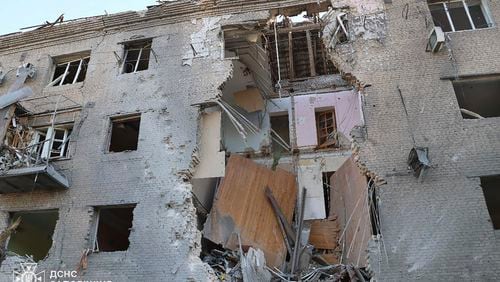 In this photo provided by the Ukrainian Emergency Service, a damaged apartment house is seen after Russia attacked the city with guided bombs overnight in Zaporizhzhia, Ukraine, Sunday, Sept. 29, 2024. (Ukrainian Emergency Service via AP)