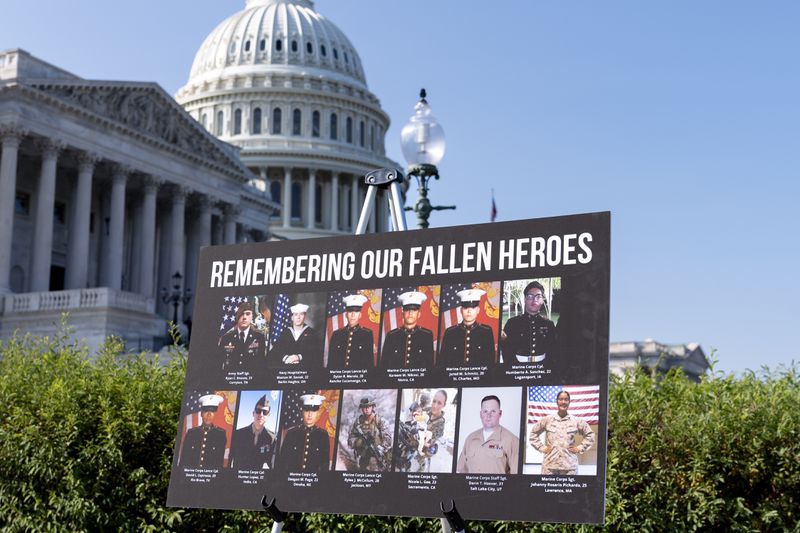 A display showing fallen American military members is displayed for a news conference by House Foreign Affairs Committee Chairman Michael McCaul, R-Texas, as he releases his panel's Afghanistan Report and the findings of its three-year investigation into the deadly U.S. withdrawal from Afghanistan, at the Capitol in Washington, Monday, Sept. 9, 2024. (AP Photo/J. Scott Applewhite)