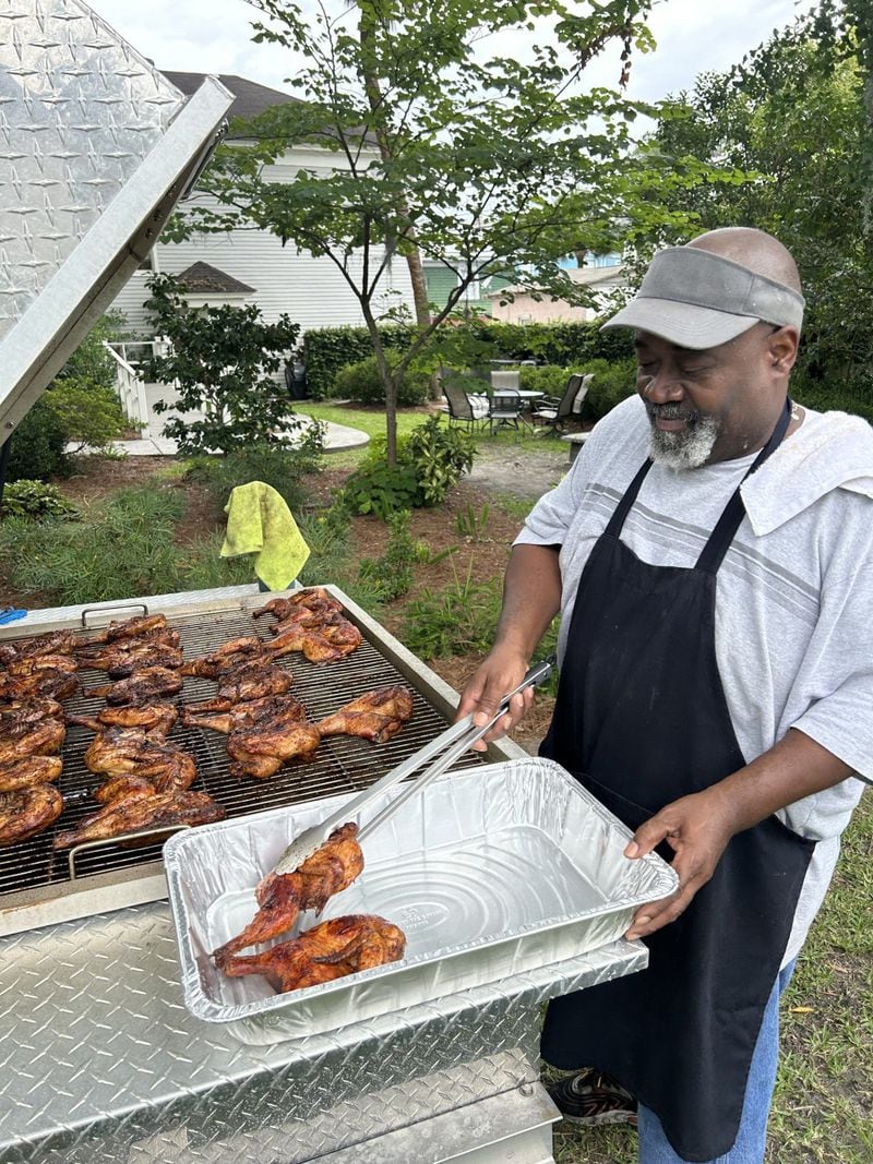 Volunteer Al Broadie mans the grill during the Urban Hope Juneteenth Fundraiser.