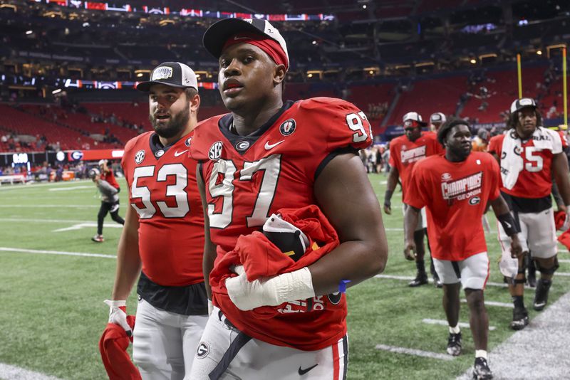 Georgia defensive lineman Warren Brinson (97) is upset that the Bulldogs reportedly have yet to receive an invitation to visit the White House in Washington, D.C. after winning the College Football Playoff championship game. (Jason Getz/The Atlanta Journal-Constitution)
