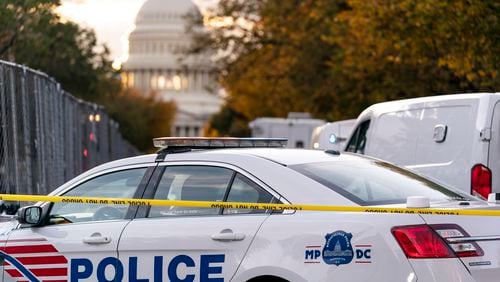 FILE - A Washington Metropolitan Police vehicle is seen near the Capitol, Oct. 19, 2022, in Washington. Police on Friday arrested a 15-year old boy on charges related to threats on social media that prompted an increased police presence at multiple schools in the nation's capital. The Instagram post showing a firearm and a list of D.C. schools prompted police to station officers at several different schools on Thursday. (AP Photo/J. Scott Applewhite, File)