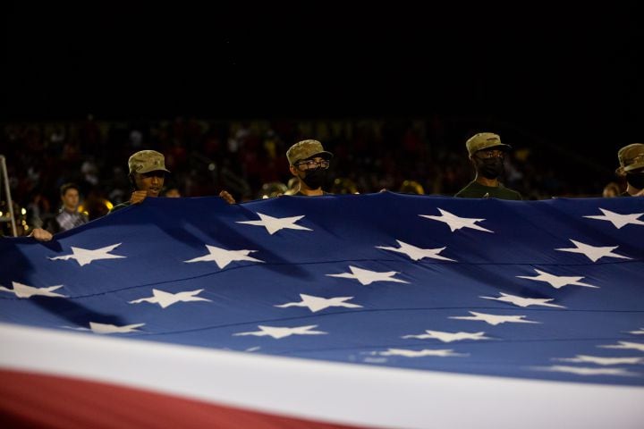 Grayson ROTC students hold the flag during a GHSA high school football game between Grayson High School and Archer High School at Grayson High School in Loganville, GA., on Friday, Sept. 10, 2021. (Photo/Jenn Finch)
