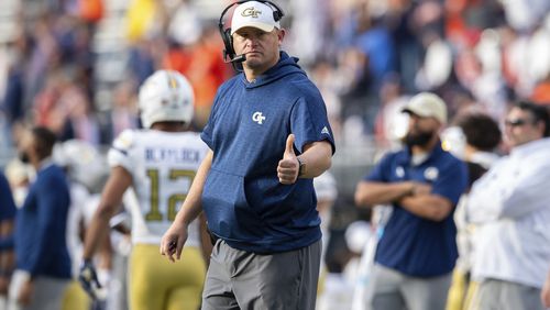 Georgia Tech head coach Brent key gives a thumbs up during the second half of an NCAA college football game against Virginia Saturday, Nov. 4, 2023, in Charlottesville, Va. (AP Photo/Mike Caudill)
