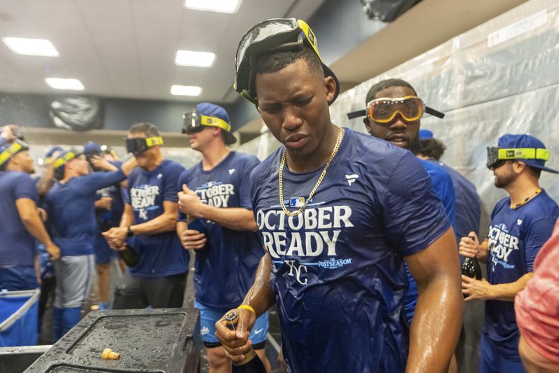 Kansas City Royals outfielder Dairon Blanco (44) celebrates in the locker room after a baseball game against the Atlanta Braves, Friday, Sept. 27, 2024, in Atlanta. (AP Photo/Jason Allen)