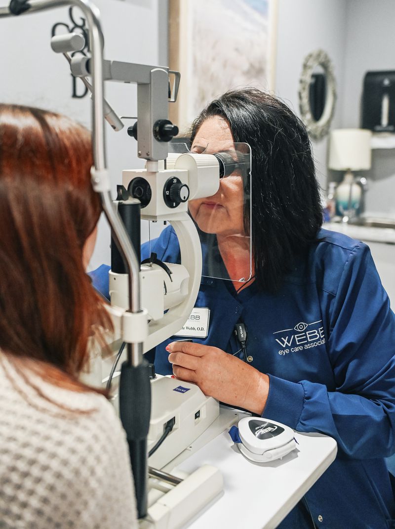 Optometrist Annette Webb checks a patient's eyes in her office in Hot Springs, Ark., on Aug. 7, 2024. (Adam Miller via AP)