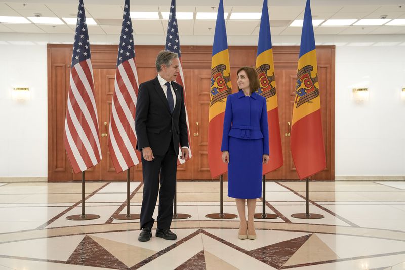 United States Secretary of State Antony Blinken. left, poses with Moldova's President Maia Sandu, right, at the Presidential Palace in Chisinau, Moldova, Wednesday, May 29, 2024. (AP Photo/Vadim Ghirda, Pool)