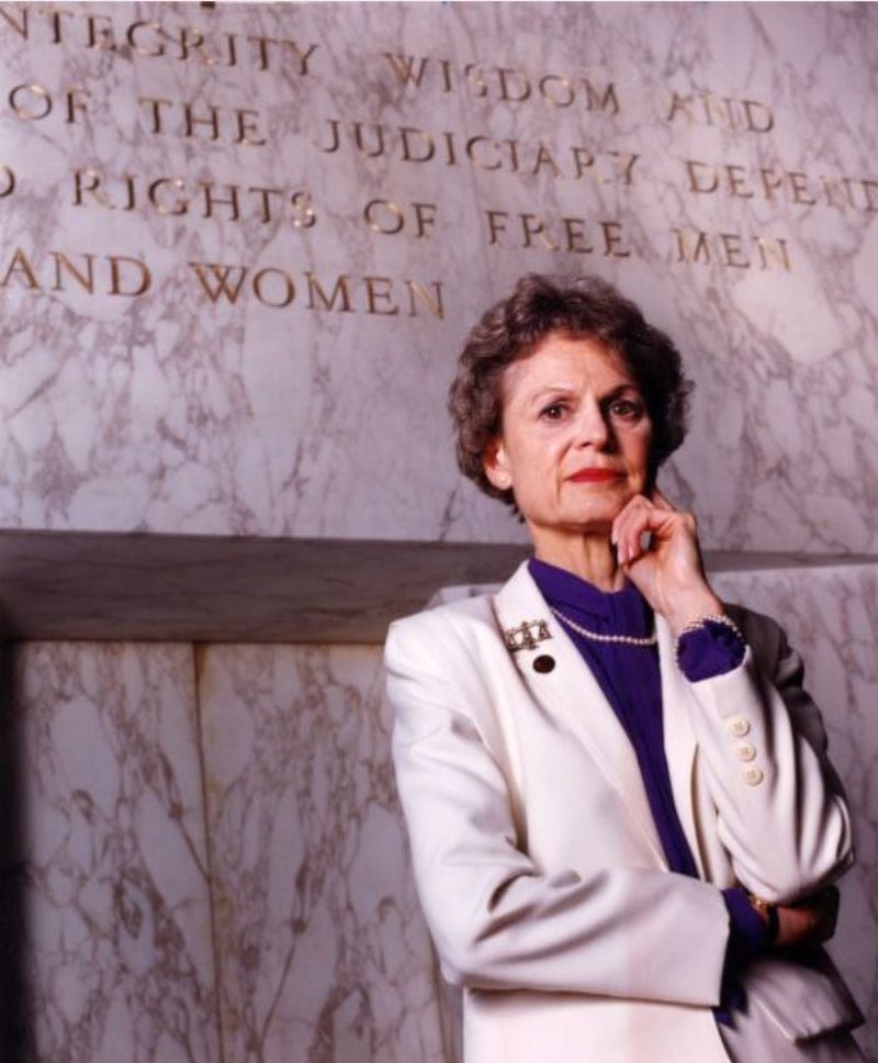 From 1993: Judge Dorothy Beasley in front of her courtroom's new motto which includes the added word "women." An AJC reporter wrote: Etched in stone and looming over the courtroom since 1956, the motto had proclaimed, "Upon the integrity, wisdom and independence of the judiciary depend the sacred rights of free men." Concerned that "men" is no longer seen as an all- inclusive term, Judge Dorothy T. Beasley suggested the addition of "and women." Her colleagues agreed, and the delicate work was done in the fall. "People have noticed and said it makes a difference," Beasley says. "To me, the arms of the law should reach out and embrace more and more into them." Jonathan Newton / AJC