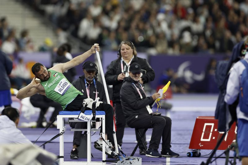 Palestine team member Fade J S Aldeeb throws during the shot put finals at the Paralympic Games in Paris on Friday, Aug. 30, 2024. (AP Photo/Nathalee Simoneau)