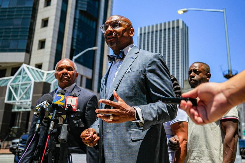 Attorney Mawuli Davis, partner of Davis-Bozeman Law Firm talks at a press conference outside the Fulton County Courthouse in Atlanta after meeting with Fulton County DA Fani Willis about Johnny Hollman's death on Tuesday, July 2, 2024.  (Ziyu Julian Zhu / AJC)