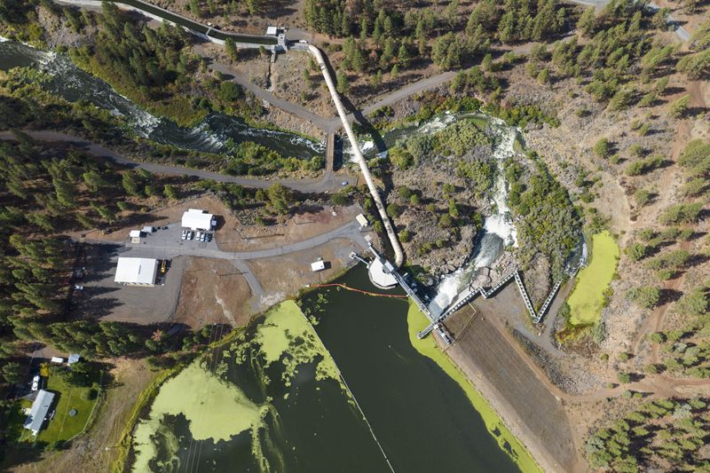 In this September 2023 image provided by Swiftwater Films shows the Klamath River and the J.C. Boyle Dam near Keno, Ore. (Swiftwater Films via AP)