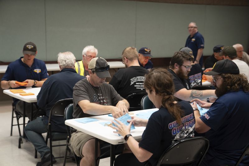 International Aerospace Machinists members count votes on a contract offer by airplane maker Boeing, on Thursday, Sept. 12, 2024, in Seattle. (AP Photo/Stephen Brashear)