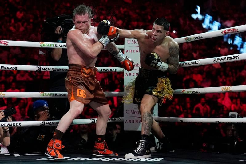 Edgar Berlanga hits Canelo Alvarez in a super middleweight title bout Saturday, Sept. 14, 2024, in Las Vegas. (AP Photo/John Locher)