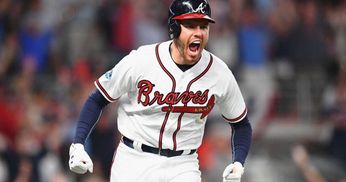 Atlanta Braves first baseman Freddie Freeman (5) holds the National League  Most Valuable Player award during a ceremony before a baseball game against  the Philadelphia Phillies Sunday, April 11, 2021, in Atlanta. (