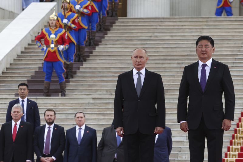 Russian President Vladimir Putin and Mongolian President Ukhnaagiin Khurelsukh, right, attend a welcome ceremony in Sukhbaatar Square in Ulaanbaatar, Mongolia, Tuesday, Sept. 3, 2024. (Vyacheslav Prokofyev, Sputnik, Kremlin Pool Photo via AP)