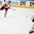 New Jersey Devils' Ondřej Palat takes a shot during a practice session, a day before their NHL hockey game against Buffalo Sabres, in Prague, Czech Republic, Thursday, Oct. 3, 2024. (AP Photo/Petr David Josek)