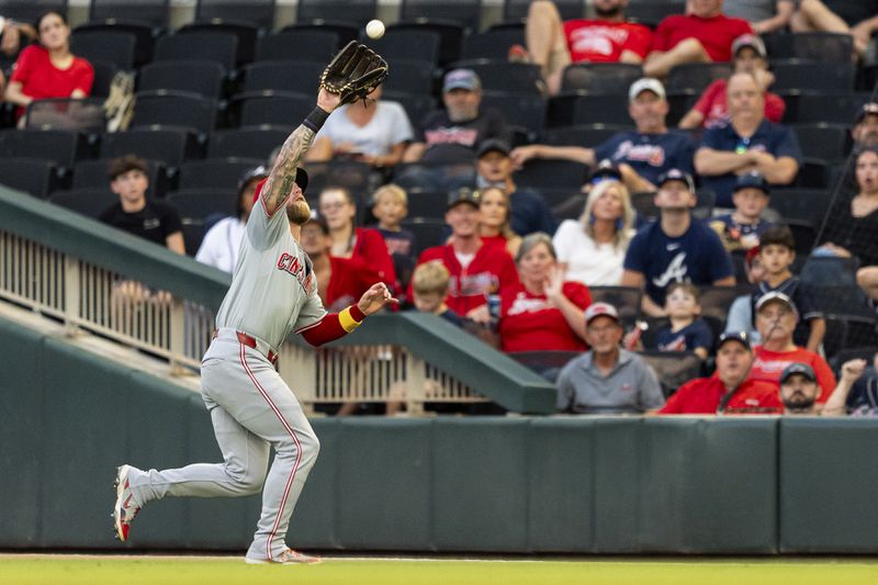 Cincinnati Reds outfielder Jake Fraley catches a pop fly hit by Atlanta Braves' Luke Williams in the third inning of a make-up baseball game, Monday, Sept. 9, 2024, in Atlanta. (AP Photo/Jason Allen)